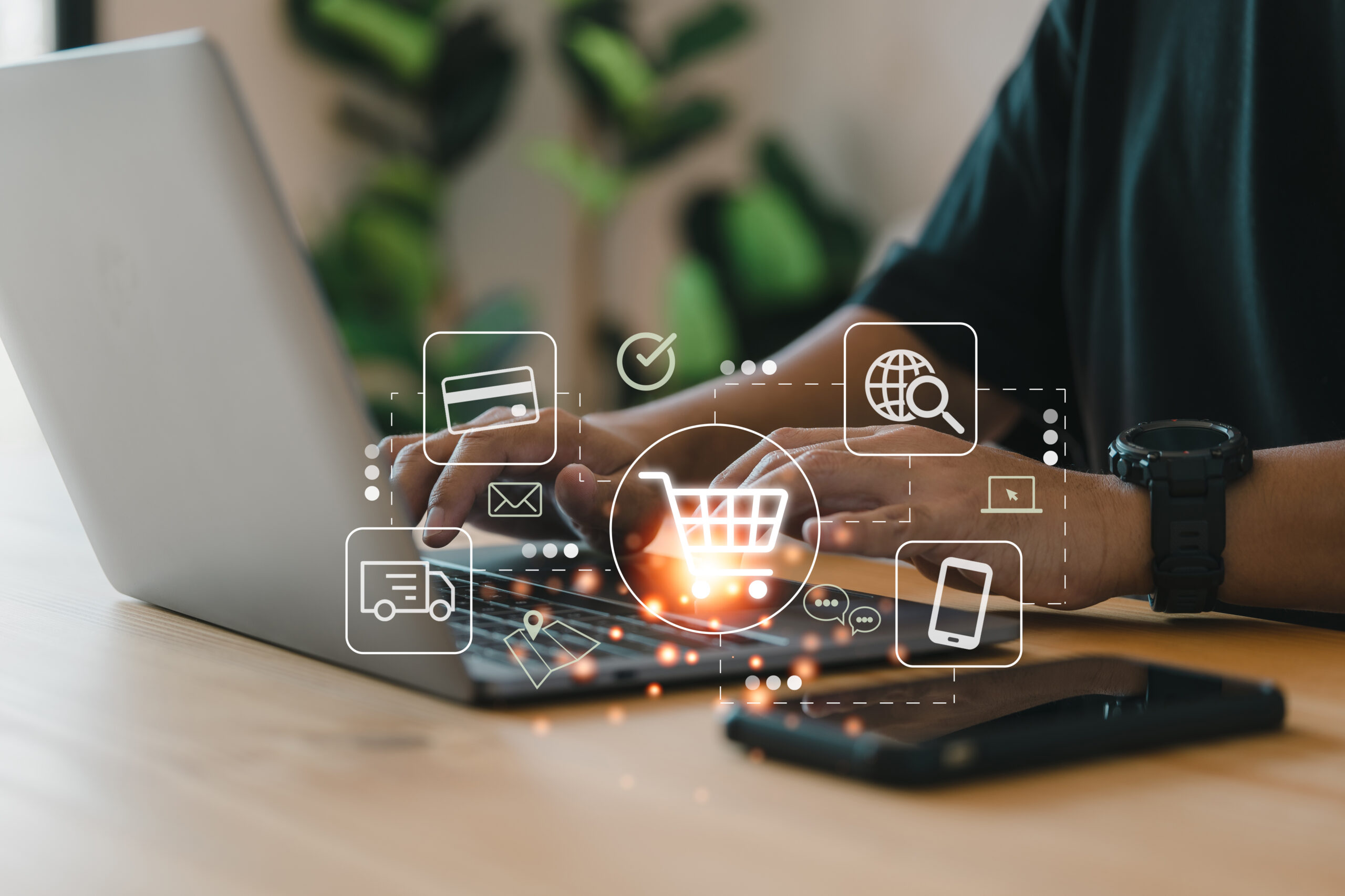 online shopping and e commerce technology concept, shopper using computer laptop to input order with trolley credit card delivery truck.